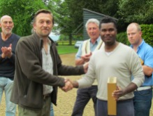 Dom Ramjag picks up his Man of the match whisky for his match winning 75*